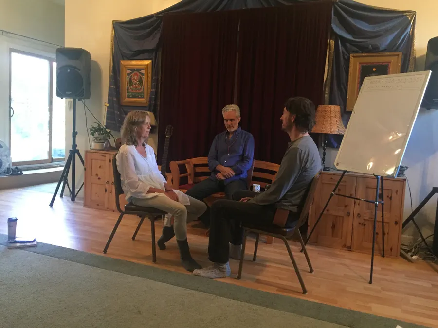 Jesper Jurcenoks doing Radical Honesty hot chair work with his partner in 2017